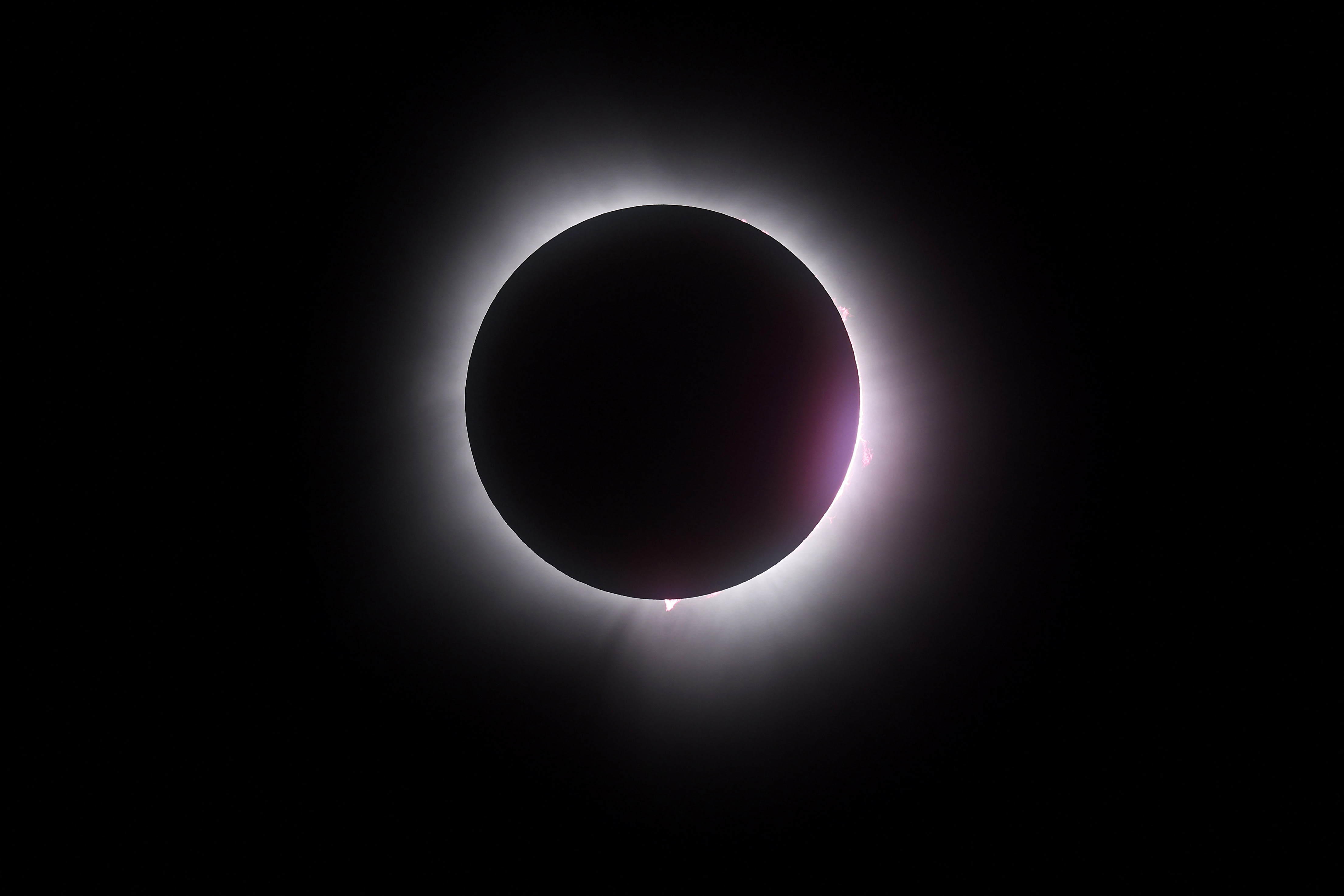 MARTIN, OHIO - APRIL 08: The moon passes in front of the sun during a solar eclipse on April 08, 2024 in Martin Ohio. Millions of people have flocked to areas across North America that are in the "path of totality" in order to experience a total solar eclipse. During the event, the moon will pass in between the sun and the Earth, appearing to block the sun.   Gregory Shamus/Getty Images/AFP (Photo by Gregory Shamus / GETTY IMAGES NORTH AMERICA / Getty Images via AFP)