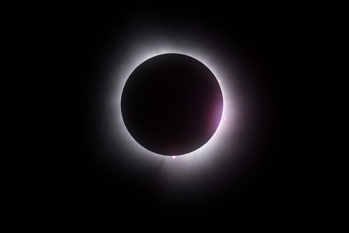 MARTIN, OHIO - APRIL 08: The moon passes in front of the sun during a solar eclipse on April 08, 2024 in Martin Ohio. Millions of people have flocked to areas across North America that are in the path of totality in order to experience a total solar eclipse. During the event, the moon will pass in between the sun and the Earth, appearing to block the sun.   Gregory Shamus/Getty Images/AFP (Photo by Gregory Shamus / GETTY IMAGES NORTH AMERICA / Getty Images via AFP)