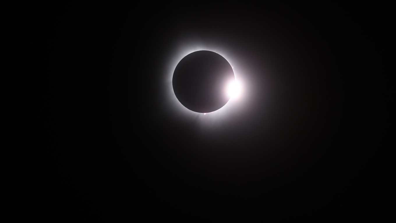 MARTIN, OHIO - APRIL 08: The moon passes in front of the sun during a solar eclipse on April 08, 2024 in Martin Ohio. Millions of people have flocked to areas across North America that are in the "path of totality" in order to experience a total solar eclipse. During the event, the moon will pass in between the sun and the Earth, appearing to block the sun. Gregory Shamus/Getty Images/AFP (Photo by Gregory Shamus / GETTY IMAGES NORTH AMERICA / Getty Images via AFP)