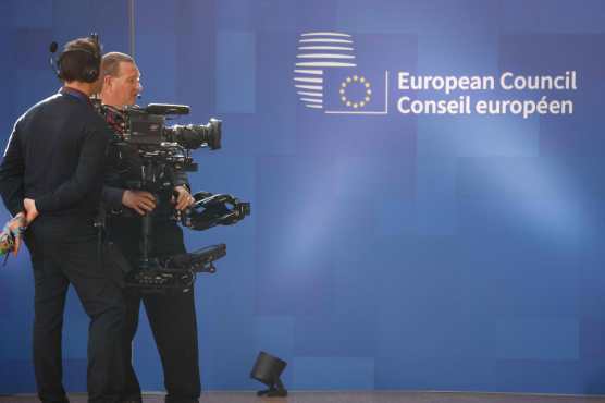 A TV crew operates ahead of a European Council summit at the EU headquarters in Brussels, on April 18, 2024. (Photo by Ludovic MARIN / AFP)