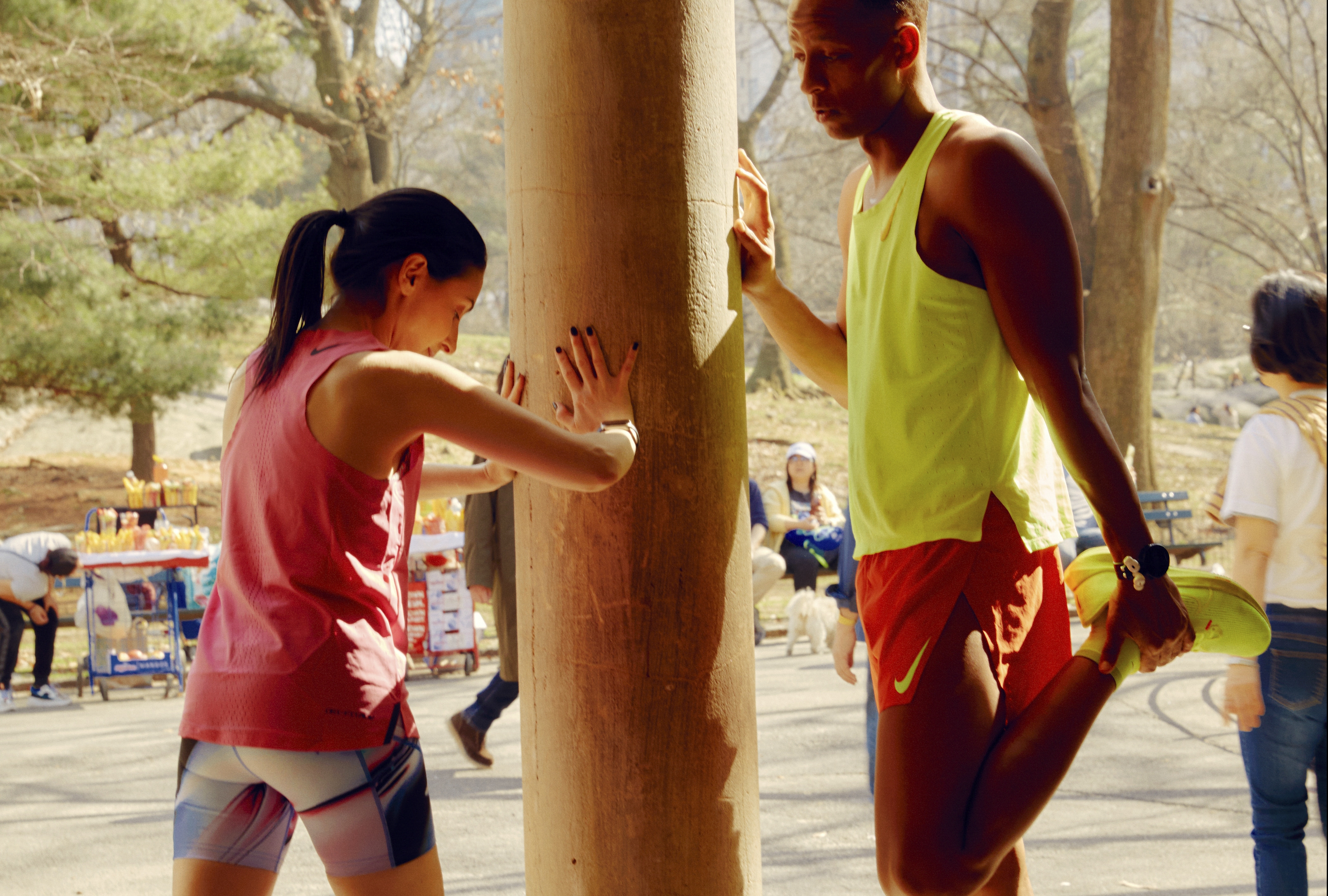 Amy Gruenhut, left, trains with Nick Arrington in Central Park in New York, March 14, 2024. After a debilitating disease, Gruenhut was unable to walk, eat or speak. Today she runs marathons. Among other things, she credits her group of running buddies. (Peter Garritano/The New York Times)
