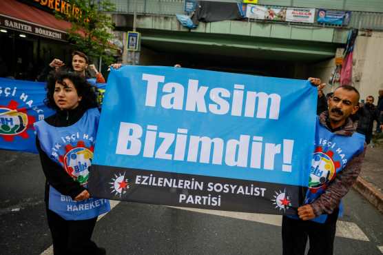 Protesters hold a banner read reads "Taksim is ours" as they attempt to march to Taksim Square, in the Mecidiyekoy district near Taksim, during a May Day (Labour Day) rally, marking International Workers' Day, in Istanbul, on May 1, 2024. Turkish police on May 1, 2024, detained dozens of protesters attempting to tear down barricades in different districts of Istanbul after authorities banned May 1 rallies at the city's main Taksim Square. (Photo by KEMAL ASLAN / AFP)