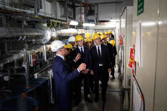 French Economy minister Bruno Le Maire (C) and French Industry delegate minister Roland Lescure (R) visit the electric powerplant for the Noirmoutier and Ile d'Yeu offshore wind farm, at the 'Chantiers de l'Atlantique' shipyards in Saint-Nazaire, western France, on May 2, 2024. (Photo by LOIC VENANCE / AFP)