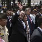 Guatemalan President Bernardo Arevalo (C) waves next to Vice-President Karin Herrera (C, right) while they head with Defence Minister Henry Saenz (L) and Interior Minister Francisco Jimenez (next to Herrera) to the Congress to present legal reforms that would allow the removal of the country's top prosecutor, in Guatemala City on May 6, 2024. Arevalo headed to Congress to present legal reforms that would allow the removal of Attorney general Consuelo Porras, who he accuses of plotting to oust him. Porras, who is under US and EU sanctions for corruption, was appointed by Arevalo's predecessor and led efforts to have the newcomer's election victory overturned. Her mandate runs until May 2026, and Arevalo cannot legally fire her without showing just cause under the current law. (Photo by Edwin BERCIAN / AFP)