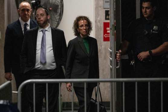 Attorney Susan Necheles (R) walks to the courtroom following a break in former US President Donald Trump's trial for allegedly covering up hush money payments linked to extramarital affairs, at Manhattan Criminal Court in New York City, on May 10, 2024. Trump is accused of falsifying business records in a scheme to cover up an alleged sexual encounter with adult film actress Stormy Daniels to shield his 2016 election campaign from adverse publicity. (Photo by JEENAH MOON / POOL / AFP)