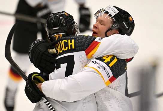 Germany's forward #77 Daniel Fischbuch (L) and Germany's defender #41 Jonas Muller celebrate after scoring during the IIHF Ice Hockey Men's World Championships match between Slovakia and Germany in Ostrava, Czech Republic on May 10, 2024. (Photo by Joe Klamar / AFP)