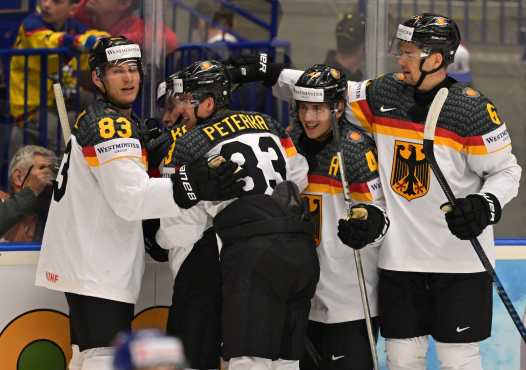 Germany's players celebrate after scoring during the IIHF Ice Hockey Men's World Championships match between Slovakia and Germany in Ostrava, Czech Republic on May 10, 2024. (Photo by Joe Klamar / AFP)
