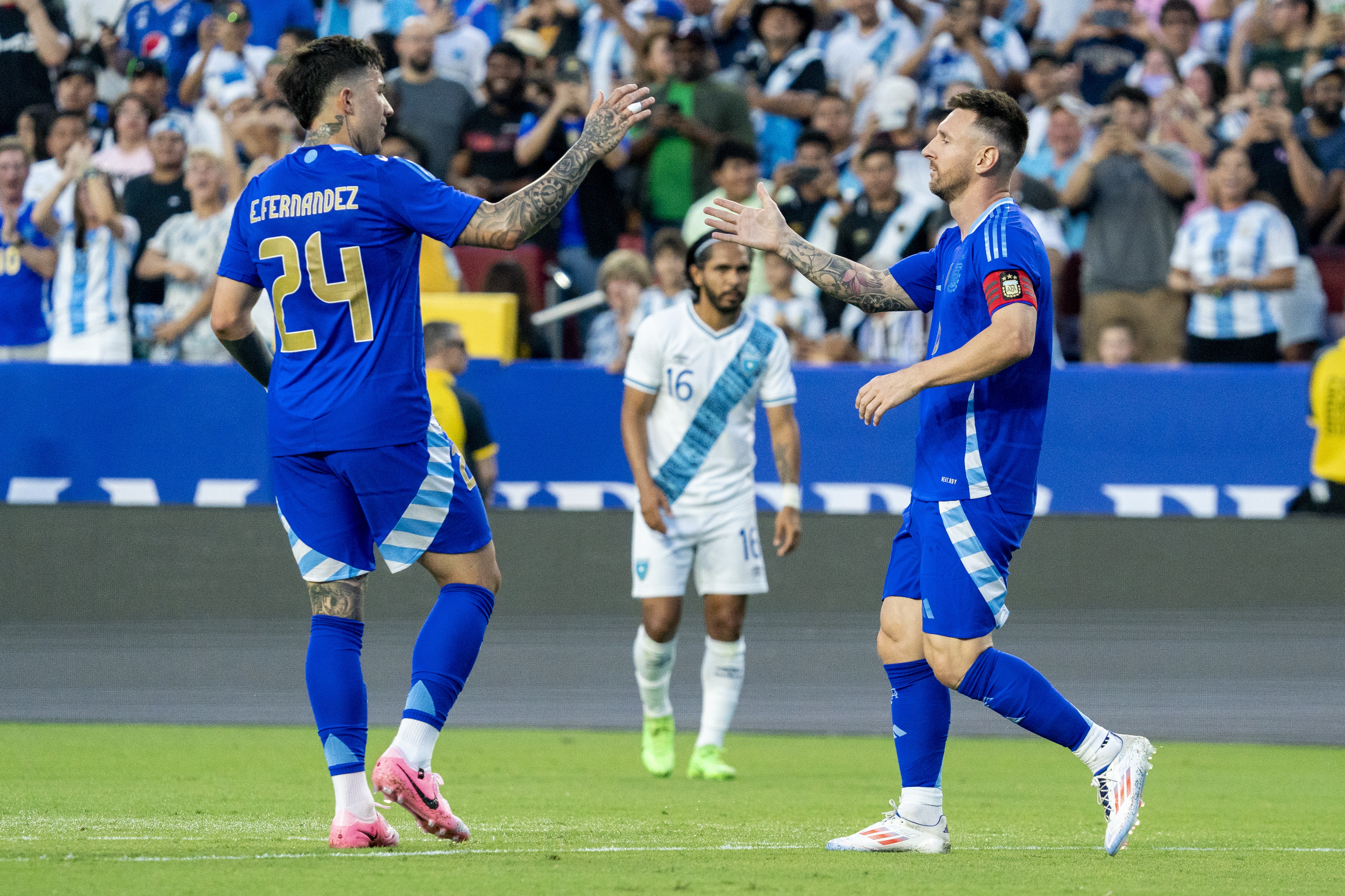 Landover (United States), 14/06/2024.- Argentina's Lionel Messi (R) celebrates scoring a goal with teammate Enzo Fernandez (L) during the friendly soccer match between Argentina and Guatemala in Landover, Maryland, USA, 14 June 2024. (Futbol, Amistoso) EFE/EPA/SHAWN THEW