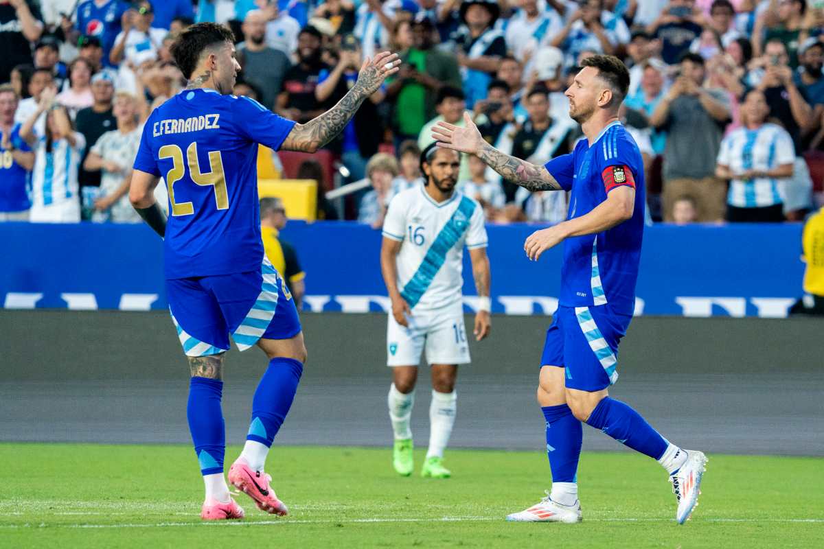 Landover (United States), 14/06/2024.- Argentina's Lionel Messi (R) celebrates scoring a goal with teammate Enzo Fernandez (L) during the friendly soccer match between Argentina and Guatemala in Landover, Maryland, USA, 14 June 2024. (Futbol, Amistoso) EFE/EPA/SHAWN THEW