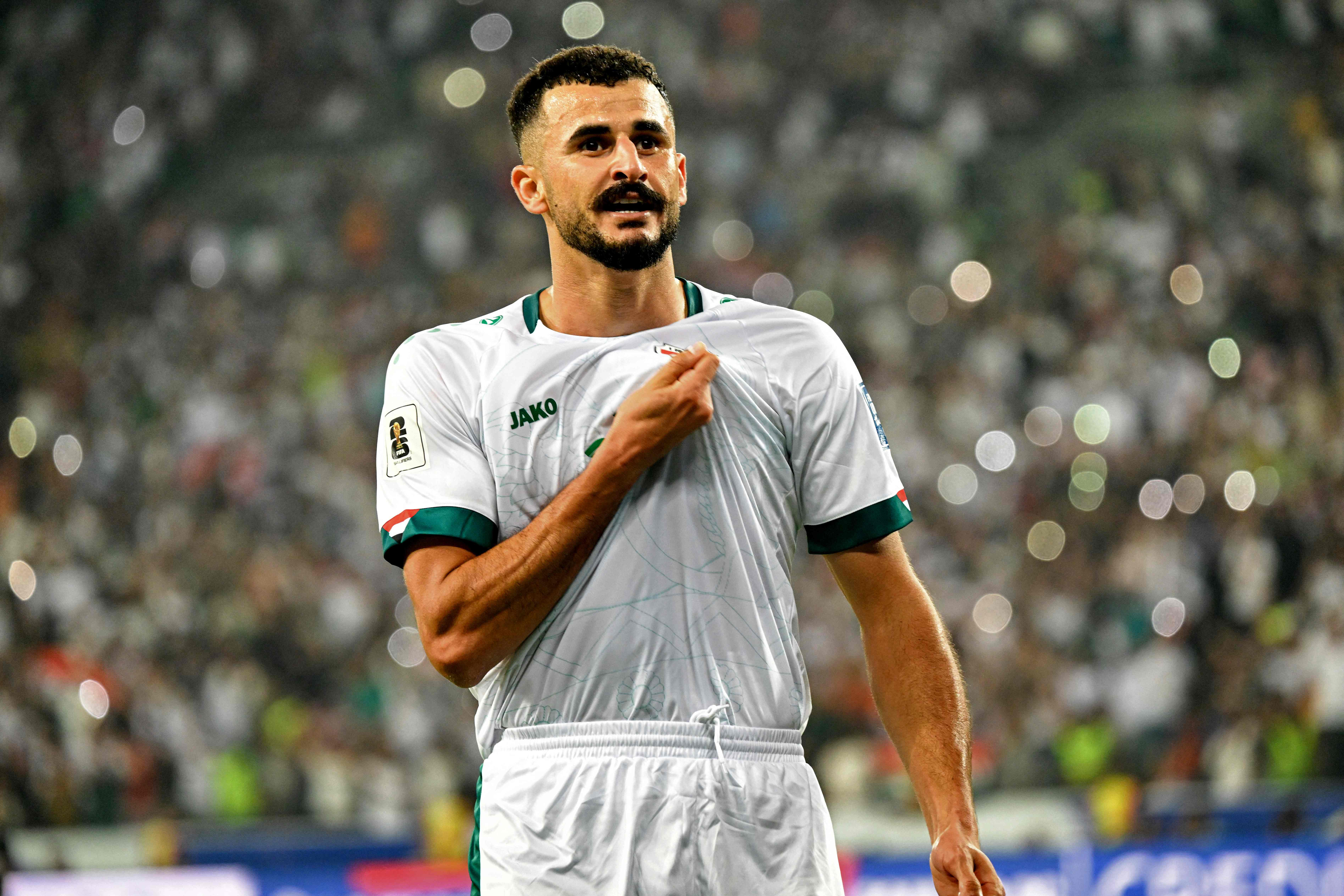 Iraq's forward #18 Aymen Hussein celebrates scoring his team's first goal during the 2026 FIFA World Cup Asian qualification football match between Iraq and Palestine at Basra International Stadium in Basra on October 10, 2024. (Photo by Hussein FALEH / AFP)