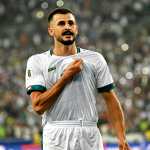 Iraq's forward #18 Aymen Hussein celebrates scoring his team's first goal during the 2026 FIFA World Cup Asian qualification football match between Iraq and Palestine at Basra International Stadium in Basra on October 10, 2024. (Photo by Hussein FALEH / AFP)