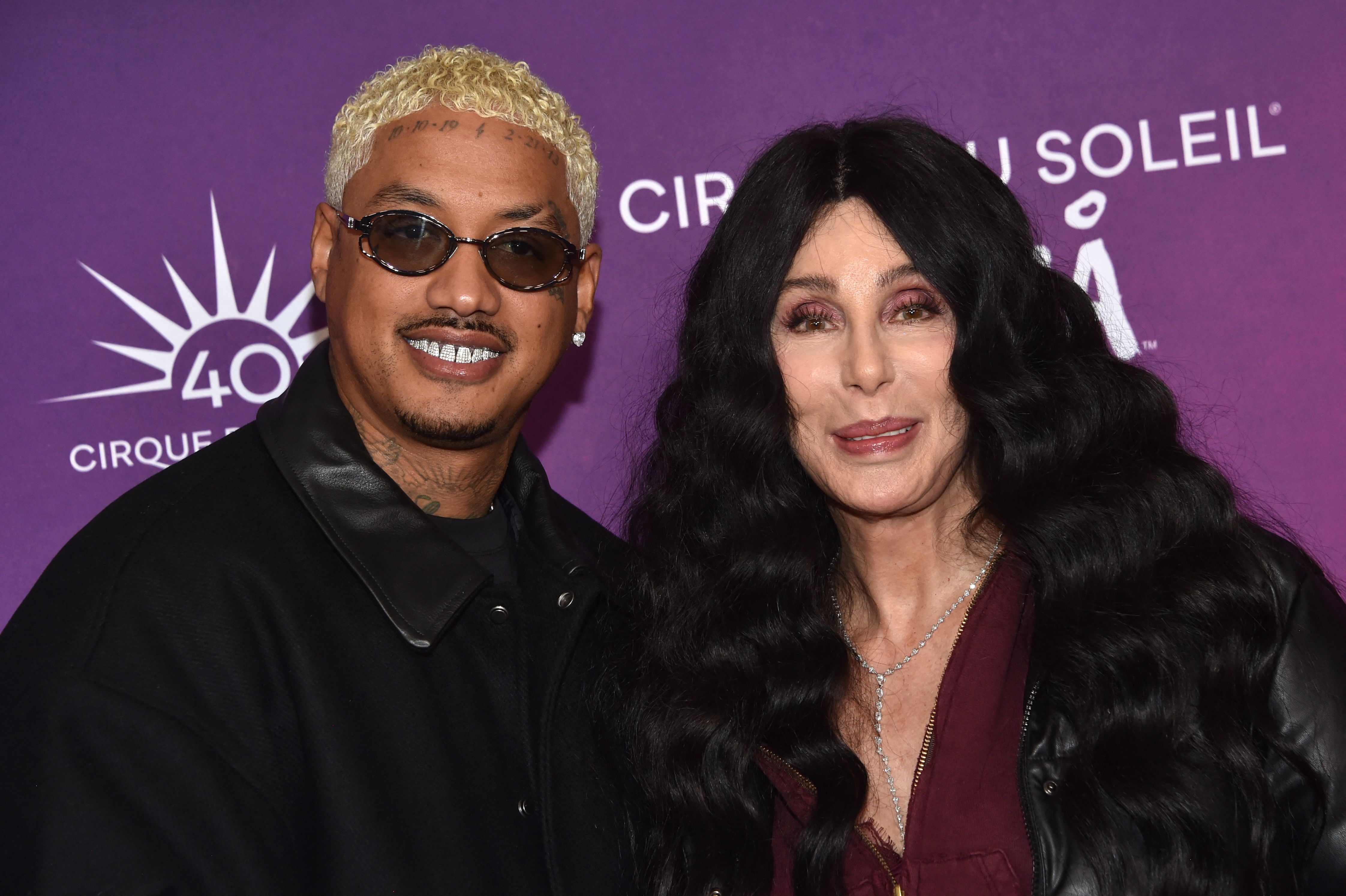 US singer and actress Cher (R) and boyfriend US rapper Alexander Edwards attend Cirque du Soleils KOOZA red carpet premiere at the Santa Monica Pier, in Santa monica, California, October 24, 2024. (Photo by Chris Delmas / AFP)