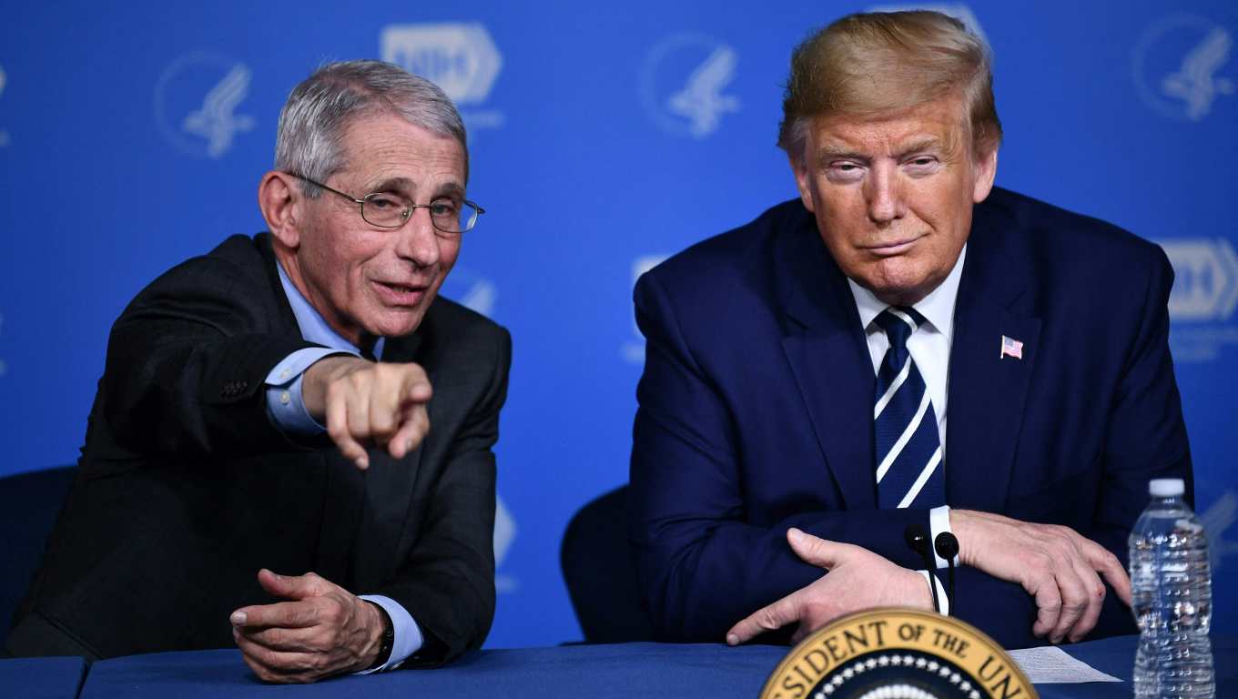 (FILES) US President Donald Trump and Anthony Fauci, director of the NIH National Institute of Allergy and Infectious Diseases attend a meeting at the National Institutes of Health in Bethesda, Maryland on March 3, 2020, following up on the COVID-19, coronavirus, outbreak. Opinion polls show Democrat Kamala Harris and Republican Donald Trump running ina statistical tie for the November 5, 2024 election, including in the seven battleground states likely to decide the national vote. (Photo by Brendan Smialowski / AFP)