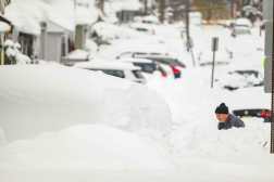 ERIE, PENNSYLVANIA - DECEMBER 2:A man clears his driveway along East 6th Street after a record snowfall left over 3 feet on the ground on December 2, 2024 in Erie, Pennsylvania.As of Monday morning, some parts of Erie County, Pennsylvania had received up to 60 inches of snow according to unofficial reports from the National Weather Service prompting the Mayor of the City of Erie to declare a weather emergency.   Jeff Swensen/Getty Images/AFP (Photo by JEFF SWENSEN / GETTY IMAGES NORTH AMERICA / Getty Images via AFP)