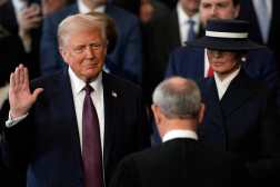 Donald Trump is sworn in as the 47th president of the United States by Chief Justice John Roberts as Melania Trump holds the Bible in the US Capitol Rotunda in Washington, DC, on January 20, 2025. Donald Trump is sworn in as the 47th president of the United States by Chief Justice John Roberts as Melania Trump holds the Bible (Photo by Julia Demaree Nikhinson / AFP)