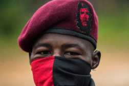 (FILES) A member of the "Omar Gomez" Western War Front of the National Liberation Army (ELN) guerrilla is photographed in a camp on the banks of the San Juan River, Choco department, Colombia, on November 20, 2017. Colombia is going through its most serious outbreak of violence in the last decade, following a series of attacks by illegal armed groups that since January 16, 2025, have left a hundred dead and 36,000 displaced. The worst conflict is concentrated in Catatumbo, a region bordering Venezuela, plagued by coca crops and where guerrillas of the National Liberation Army (ELN) are confronting dissidents of the defunct FARC guerrilla group and attacking the civilian population. (Photo by Luis ROBAYO / AFP) / TO GO WITH AFP STORY