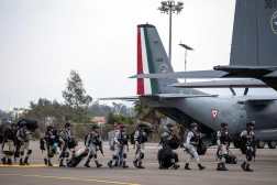 Mexico's National Guard officers arrive at Tijuana International Airport in Tijuana, Baja California state, Mexico, on February 4, 2025. Mexico began the 10,000-strong border troop deployment it had promised US President Donald Trump in exchange for delaying a 25-percent tariff on exported goods, President Claudia Sheinbaum said. (Photo by Guillermo Arias / AFP)