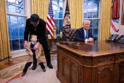 Tesla and SpaceX CEO Elon Musk plays with his son X Æ A-Xiis gold necklace as they join US President Donald Trump in the Oval Office of the White House in Washington, DC, on February 11, 2025. Tech billionaire Elon Musk, who has been tapped by President Donald Trump to lead federal cost-cutting efforts, said the United States would go "bankrupt" without budget cuts. Musk leads the efforts under the newly created Department of Government Efficiency (DOGE), and was speaking at the White House with Trump, who has in recent weeks unleashed a flurry of orders aimed at slashing federal spending. (Photo by Jim WATSON / AFP)