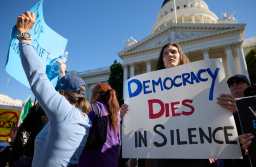 Protestors with signs gather in front of the California Capitol Building during the 50 States 50 Protests 1 Day protest against Project 2025 and the policies of US President Donald Trump in Sacramento, California, on February 5, 2025. The 50501 Movement50 states, 50 protests, one dayis calling for protests outside each state capitol. (Photo by FRED GREAVES / AFP)