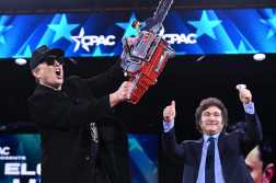 TOPSHOT - Elon Musk (L) holds a chainsaw alongside Argentine President Javier Milei during the annual Conservative Political Action Conference (CPAC) at the Gaylord National Resort & Convention Center at National Harbor in Oxon Hill, Maryland, on February 20, 2025. (Photo by SAUL LOEB / AFP)