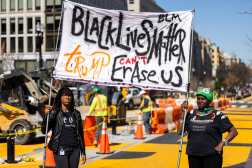 WASHINGTON (United States), 10/03/2025.- Protestors hold a sign as local government crews begin reconstruction of the Black Lives Matter (BLM) Plaza across from the White House in Washington, DC, USA, 10 March 2025. Republican lawmakers threatened to withhold federal funds from the city unless DC Mayor Muriel Bowser removed the two-block-long 'Black Lives Matter' mural and renamed the plaza. EFE/EPA/JIM LO SCALZO