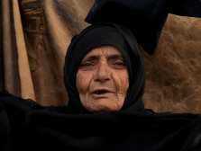 SANA'A (Yemen), 16/03/2025.- A displaced Yemeni woman reacts outside her shelter at a makeshift camp for Internally Displaced Persons (IDPs) in Sana'a, Yemen, 15 March 2025. The World Food Programme (WFP) has issued a warning about the escalating hunger crisis in war-ravaged Yemen, where over 17.6 million people out of the country's 30-million population could be severely food insecure in 2025. According to the United Nations, Yemen remains one of the world's most complex humanitarian crises, with over four million people displaced due to prolonged conflict and economic instability. EFE/EPA/YAHYA ARHAB