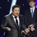 LOS ANGELES, CALIFORNIA - MARCH 15: Eric Bauza accepts the Outstanding Voice Performer in a Children's or Young Teen Program award for "Teen Titans Go!" onstage from Walker Scobell during the 3rd Annual Children's and Family Emmy Awards at Television City Studios on March 15, 2025 in Los Angeles, California. Amy Sussman/Getty Images/AFP (Photo by Amy Sussman / GETTY IMAGES NORTH AMERICA / Getty Images via AFP)