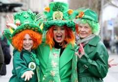 Revellers pose for a photograph during the annual St Patrick's Day parade in Dublin on March 17, 2025. (Photo by PAUL FAITH / AFP)