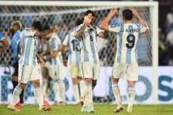 Argentina's forward #09 Julian Alvarez and teammate midfielder #08 Enzo Fernandez celebrate their victory during the 2026 FIFA World Cup South American qualifiers football match between Uruguay and Argentina at the Centenario stadium in Montevideo, on March 21, 2025. (Photo by DANTE FERNANDEZ / AFP)