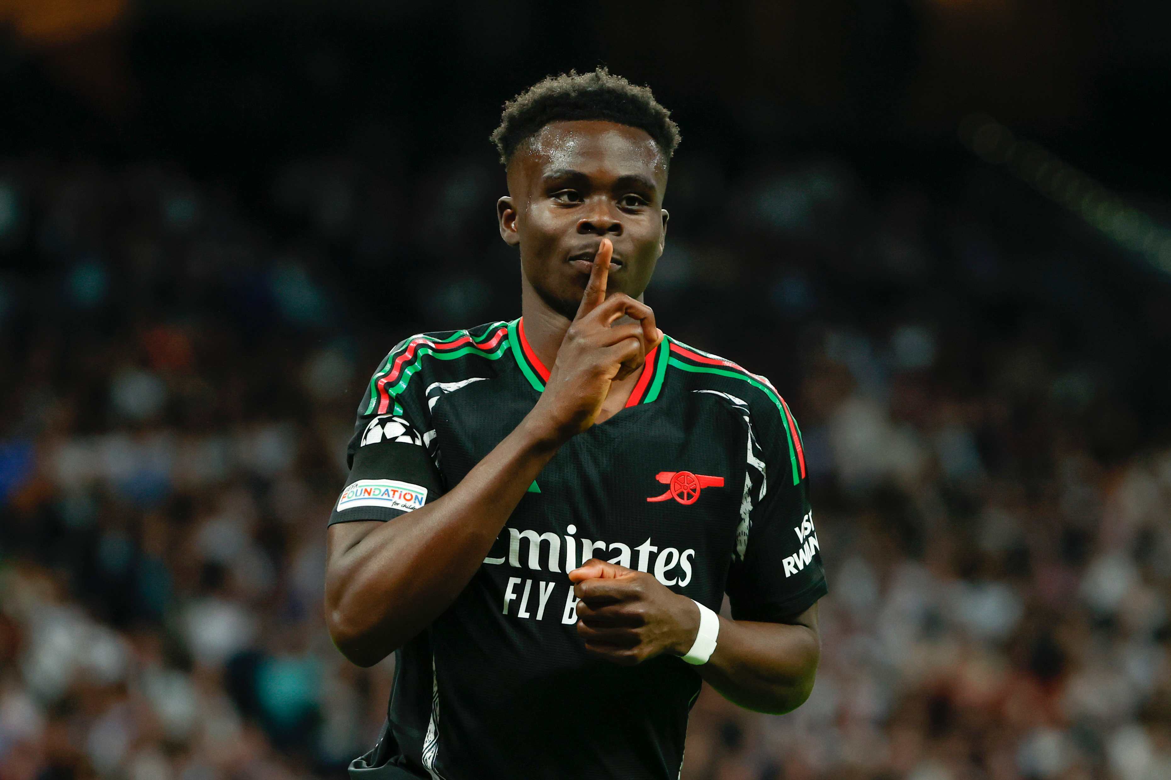 Arsenal striker Bukayo Saka celebrates his goal during the second leg of the Champions League.
