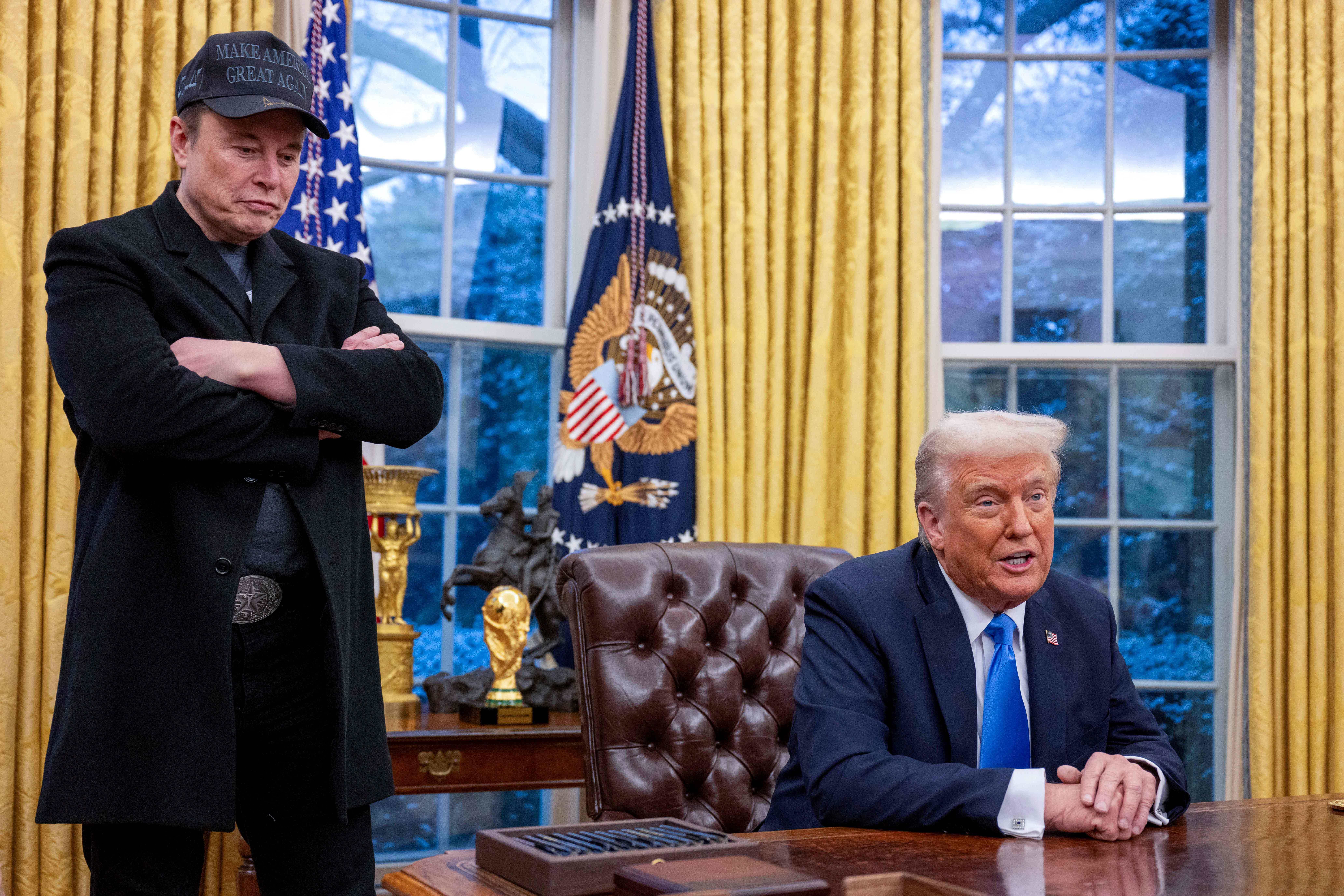 (Files) Elon Musk listens as US President Donald Trump Speaks in the Oval Office of the White House in Washington, DC, On February 11, 2025. Musk's Rise as President Donald Trump's All-Powerful Wingman was as rapid and ustoypable as One of His Spacex Rockets. But reports APIL 2, 2025 are Fueling Speculation that the Billionaire's Political Career May Be Coming Back To Earth. Political and ABC News Quoted Unnamed Sources Saying Musk Could Step Away From An Unpredentd Role In Which He is Spearheading Brutal Cuts to Us Government Services and Has Emerged Only Second To Trump As The Face of the Administration. (Photo by Jim Watson / AFP)