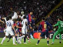 TOPSHOT - Inter Milan's Dutch defender #02 Denzel Dumfries (2L) scores his team's third goal during the UEFA Champions League semi final first leg football match between FC Barcelona and Inter Milan at the Estadi Olimpic Lluis Companys in Barcelona on April 30, 2025. (Photo by Josep LAGO / AFP)