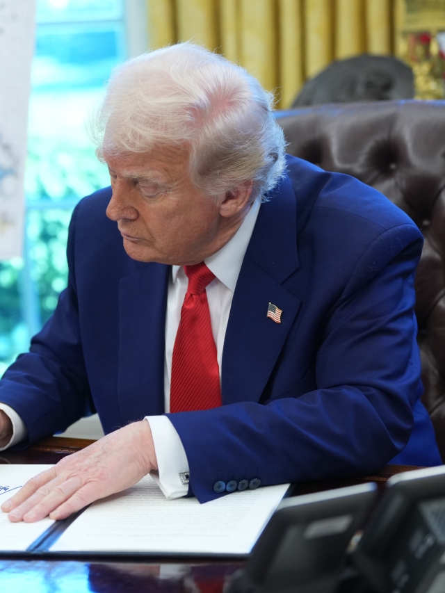 US President Trump signs executive orders in the Oval Office