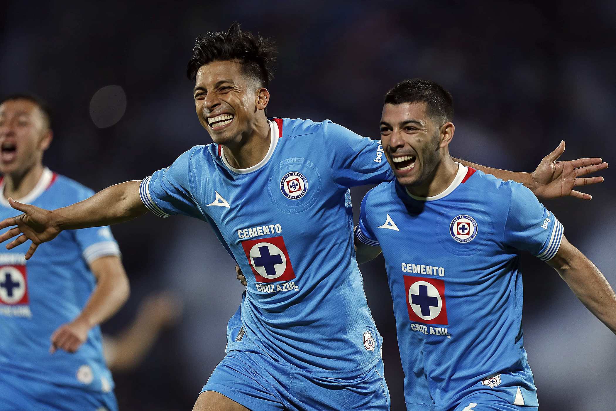 Ángel Sepúlveda and Erik Lira de Cruz Azul celebrate a goal in the second leg of the Concacaf Cup semifinal.
