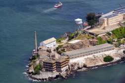 (FILES) An aerial view shows Alcatraz island in San Francisco, California on May 16, 2024. US President Donald Trump said on May 4, 2025 he had directed officials to rebuild and reopen Alcatraz prison, the notorious federal jail based on a small island in California that closed six decades ago. (Photo by JOSH EDELSON / AFP)