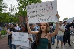 People hold up signs during the Harvard Students for Freedom rally in support of international students at the Harvard University campus in Boston, Massachusetts, on May 27, 2025. Harvard students protested Tuesday after the US government said it intends to cancel all remaining financial contracts with the university, President Donald Trump's latest attempt to force the prestigious institution to submit to unprecedented oversight. (Photo by Rick Friedman / AFP)