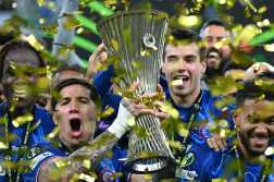 Chelsea's players celebrate with the trophy after the UEFA Conference League final football match between Real Betis and Chelsea FC in Wroclaw on May 28, 2025. (Photo by Sergei GAPON / AFP)