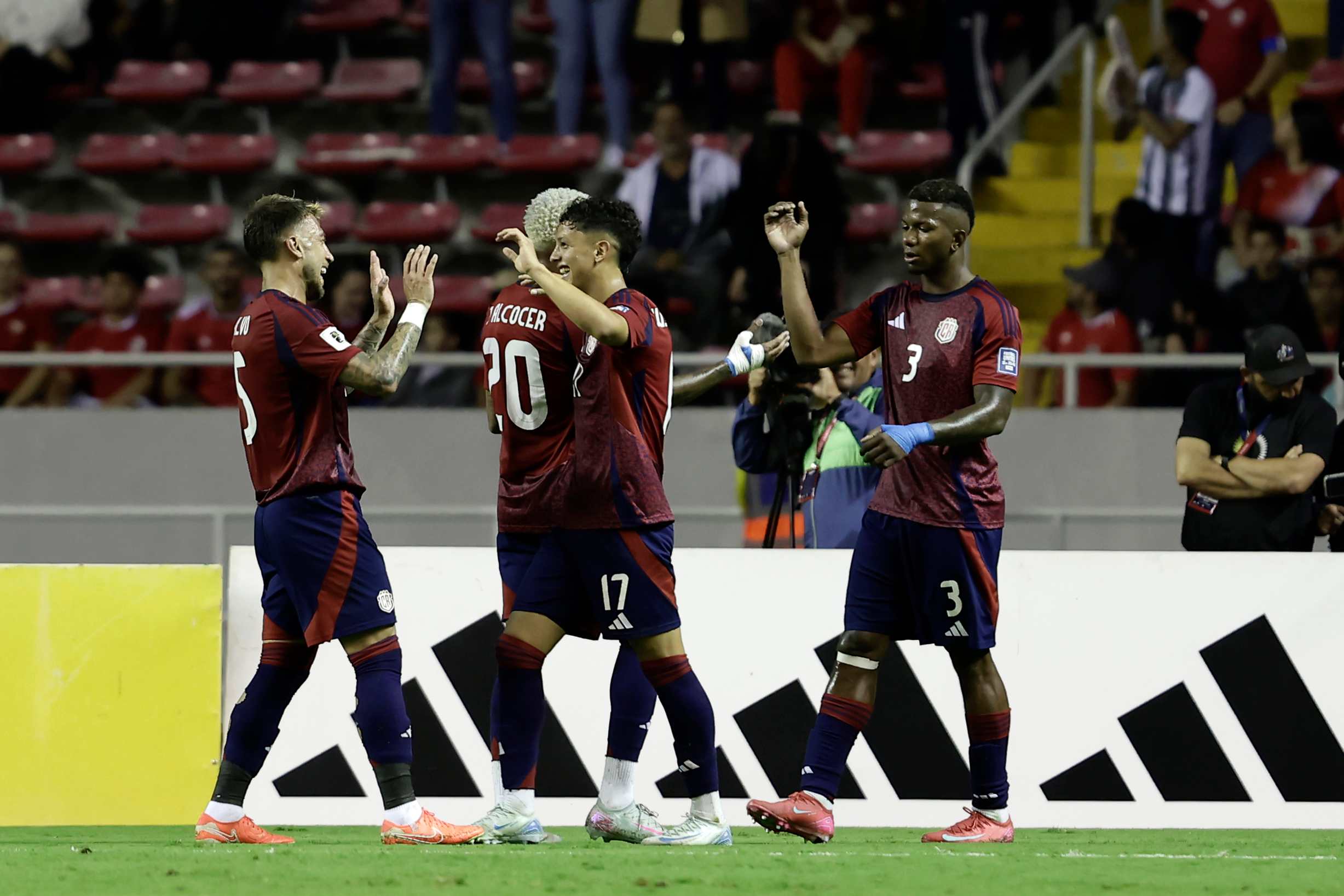 Costa Rica players celebrate after scoring a goal in a match for the Concacaf Qualifiers.