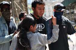 NEW YORK, NEW YORK - JUNE 04: A child attempts to embrace her father as he is escorted by federal agents with other detainees to vehicles after exiting an Intensive Supervision Appearance Program office on June 04, 2025 in New York City. Federal agents are arresting immigrants during mandatory check-ins, as ICE ramps up enforcement following immigration court hearings. The Trump administration has ordered officials to increase detentions to 3,000 migrants per day.   Michael M. Santiago/Getty Images/AFP (Photo by Michael M. Santiago / GETTY IMAGES NORTH AMERICA / Getty Images via AFP)