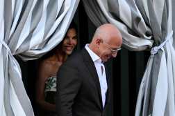 Amazon founder Jeff Bezos and Lauren Sanchez get on a taxi boat at the Aman Hotel in Venice on June 26, 2026. Celebrities in superyachts sail into Venice this week for the three-day wedding party of Amazon tycoon Jeff Bezos and Lauren Sanchez, despite irate locals who say the UNESCO city is no billionaire's playground. The tech magnate and journalist have reportedly invited about 200 guests to their multi-million dollar nuptials in the Italian city, which are expected to kick off on June 26 and end Saturday with a ceremony at a secret location. (Photo by Stefano Rellandini / AFP)