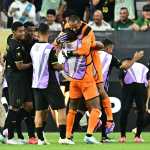 Honduras goalkeeper #01 Edrick Menjívar celebrates with teammates after winning the CONCACAF Gold Cup quartefinal match between Panama and Honduras at State Farm Stadium in Glendale, Arizona on June 28, 2025. (Photo by Frederic J. Brown / AFP)