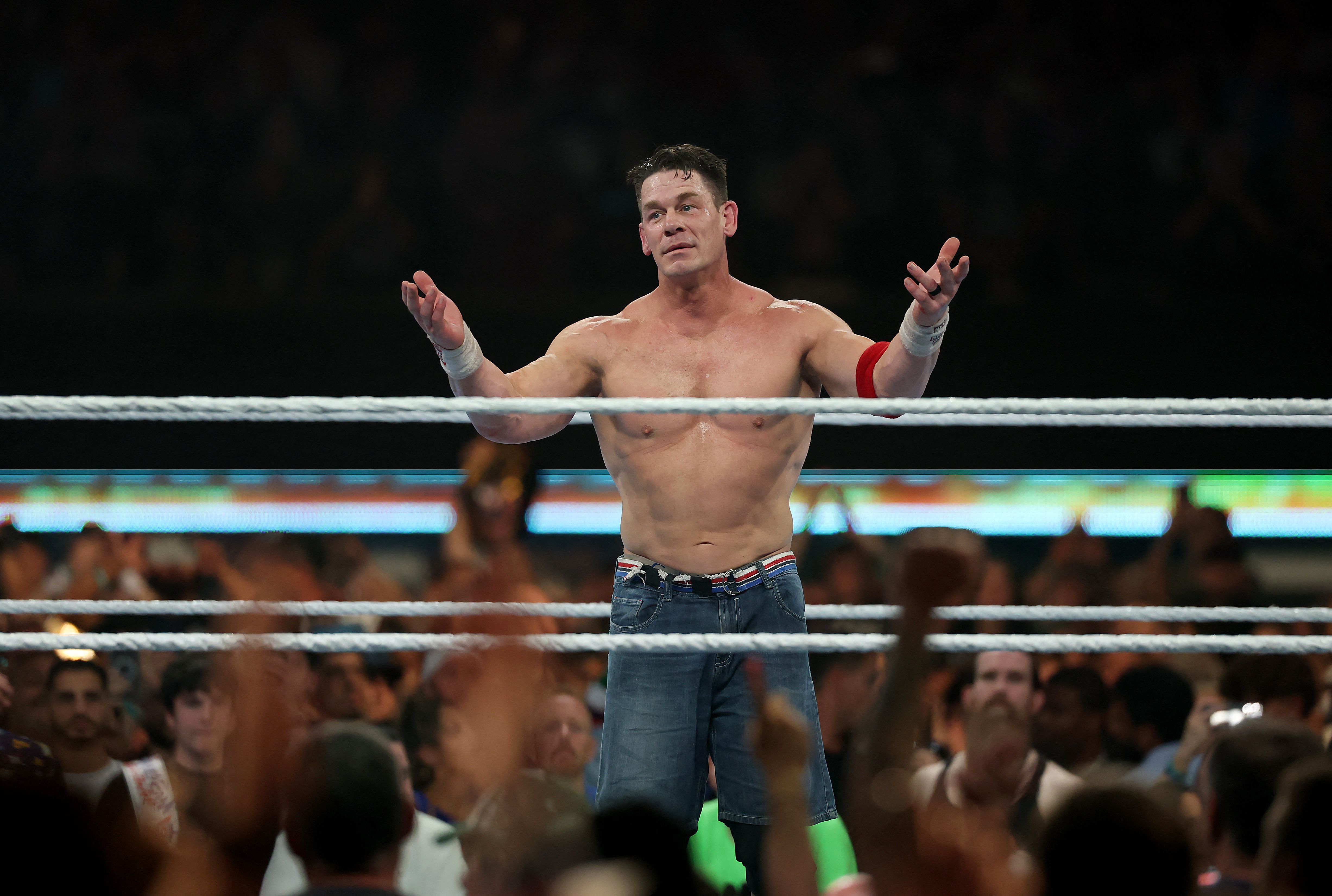 EAST RUTHERFORD, NEW JERSEY - AUGUST 03: John Cena salutes the fans after the loss to Cody Rhodes during the WWE 2025 SummerSlam at MetLife Stadium on August 03, 2025 in East Rutherford, New Jersey.   Elsa/Getty Images/AFP (Photo by ELSA / GETTY IMAGES NORTH AMERICA / Getty Images via AFP)