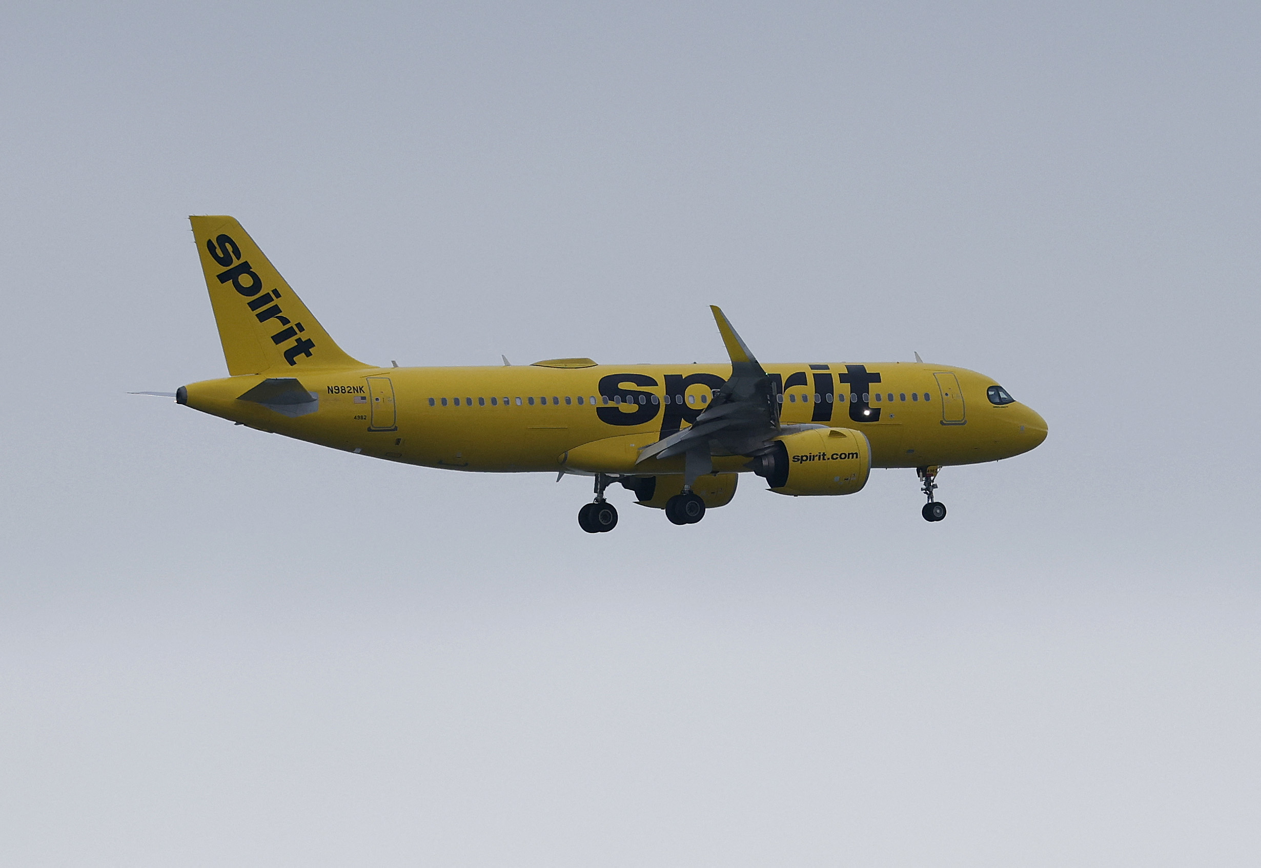 OAKLAND, CALIFORNIA - AUGUST 13: A Spirit Airlines plane prepares to land at Oakland International Airport on August 13, 2025 in Oakland, California. Budget airline Spirit Airlines is warning that the struggling company might soon run out of money and be unable to continue operations. The airline has struggled to recover from the COVID-19 pandemic and increased operating costs, which led the company to seek bankruptcy protection in late 2024.   Justin Sullivan/Getty Images/AFP (Photo by JUSTIN SULLIVAN / GETTY IMAGES NORTH AMERICA / Getty Images via AFP)