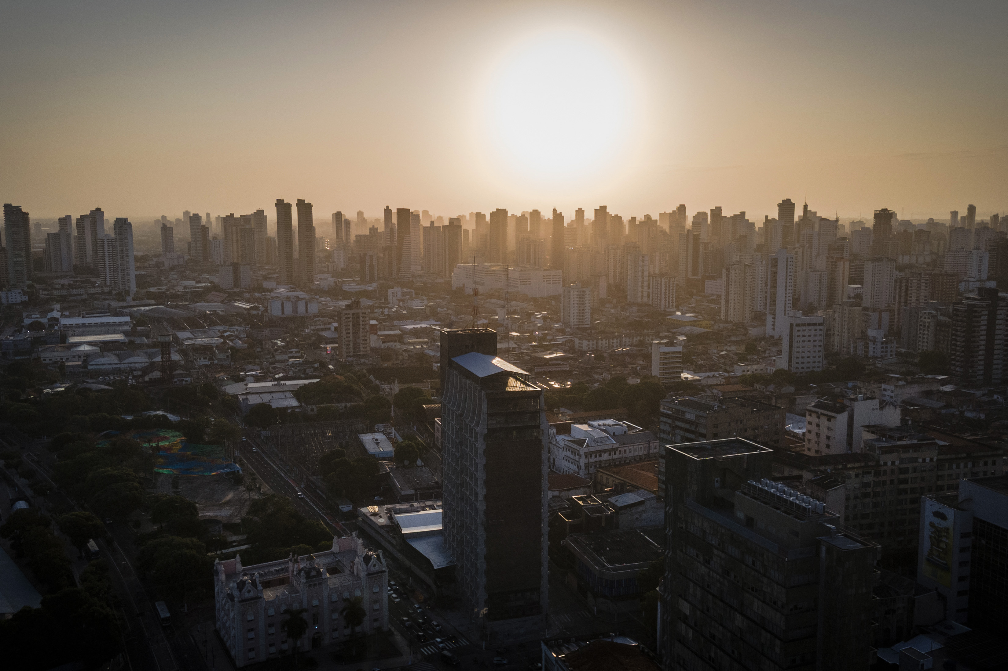 This aerial view shows buildings in downtown Belem, Para State, Brazil on August 26, 2025. Brazil will host the UN climate conference COP30 from November 10 to 21 in the Amazonian city of Belem. (Photo by Anderson Coelho / AFP)