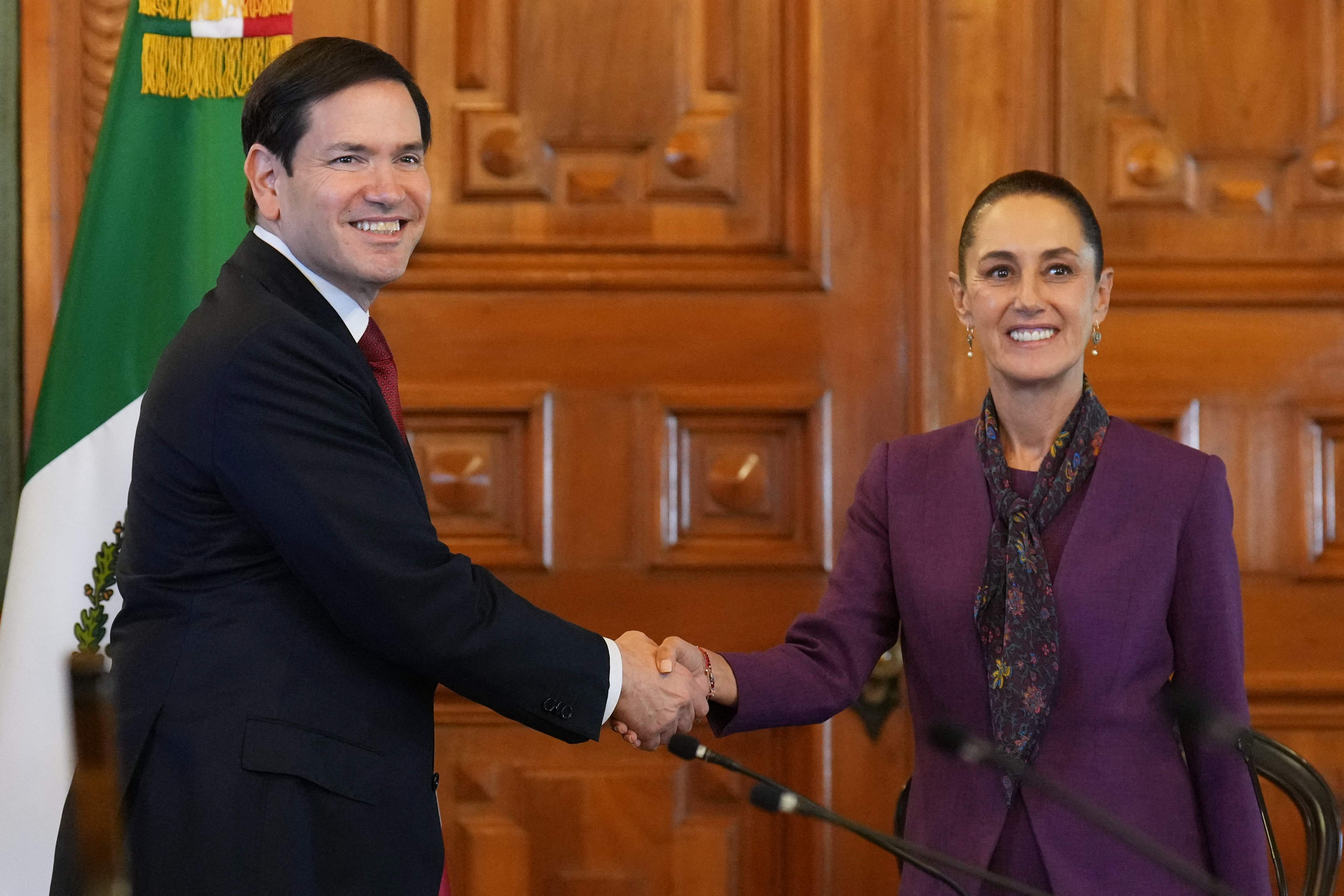 US Secretary of State Marco Rubio shakes hands with Mexico's President Claudia Sheinbaum at the Palacio Nacional in Mexico City on September 3, 2025. US Secretary of State Marco Rubio meet Mexican President Claudia Sheinbaum on September 3, 2025, a day after US dramatically escalated pressure on cartels with what it said was a targeted strike near Venezuela. (Photo by Jacquelyn Martin / POOL / AFP)
