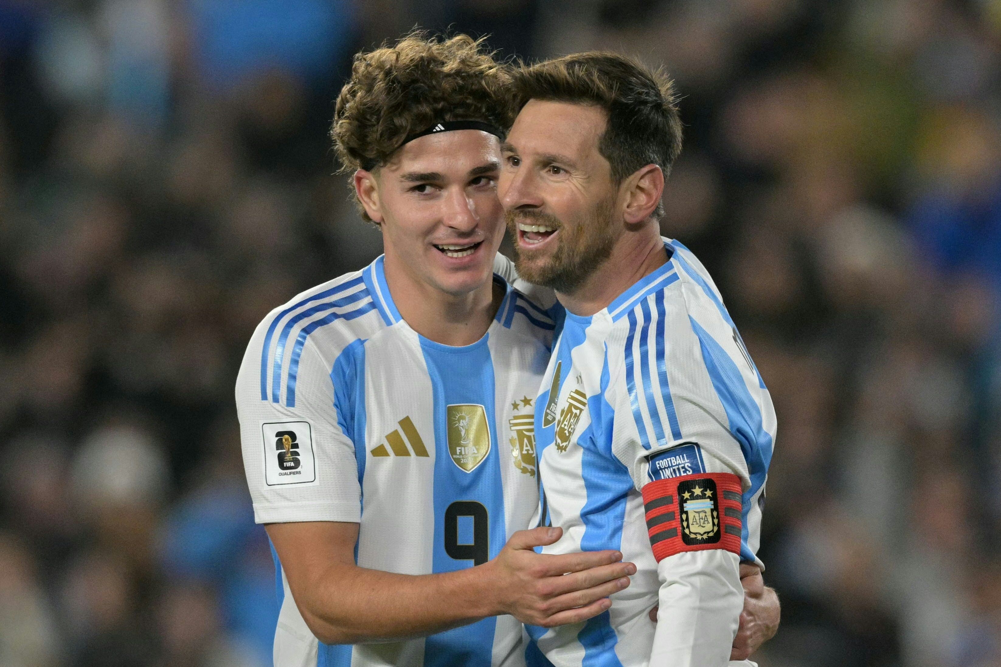 Argentina's forward #10 Lionel Messi celebrates after scoring his second goal with forward #09 Julian Alvarez during the 2026 FIFA World Cup South American qualifiers football match between Argentina and Venezuela at the Mas Monumental stadium in Buenos Aires on September 4, 2025. (Photo by JUAN MABROMATA / AFP)