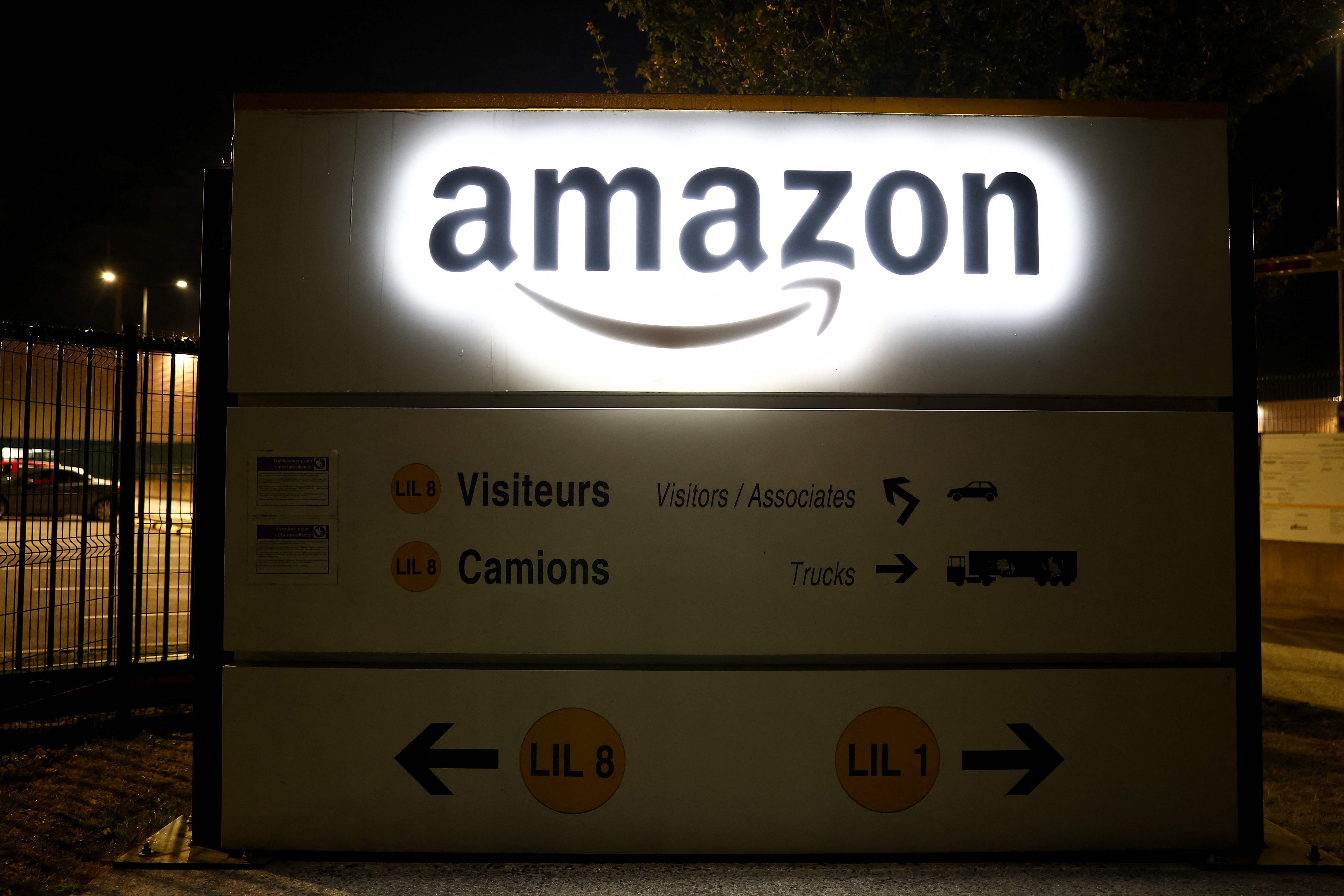 The entrance to an Amazon warehouse stands quiet as access roads remain blocked by protesters during a demonstration by the "Bloquons tout" ("Let's block everything") movement in Lauwin-Planque, northern France, on September 10, 2025. The broad anti-government campaign, dubbed "Bloquons tout" ("Let's block everything"), calls for a a shutdown of France on September 10 with a string of protest actions and civil disobedience around the country, while the handover of power between the new Prime Minister and his predecessor, who suffered a crushing loss in a confidence vote on September 8, is scheduled for the same day at noon. (Photo by Sameer AL-DOUMY / AFP)
