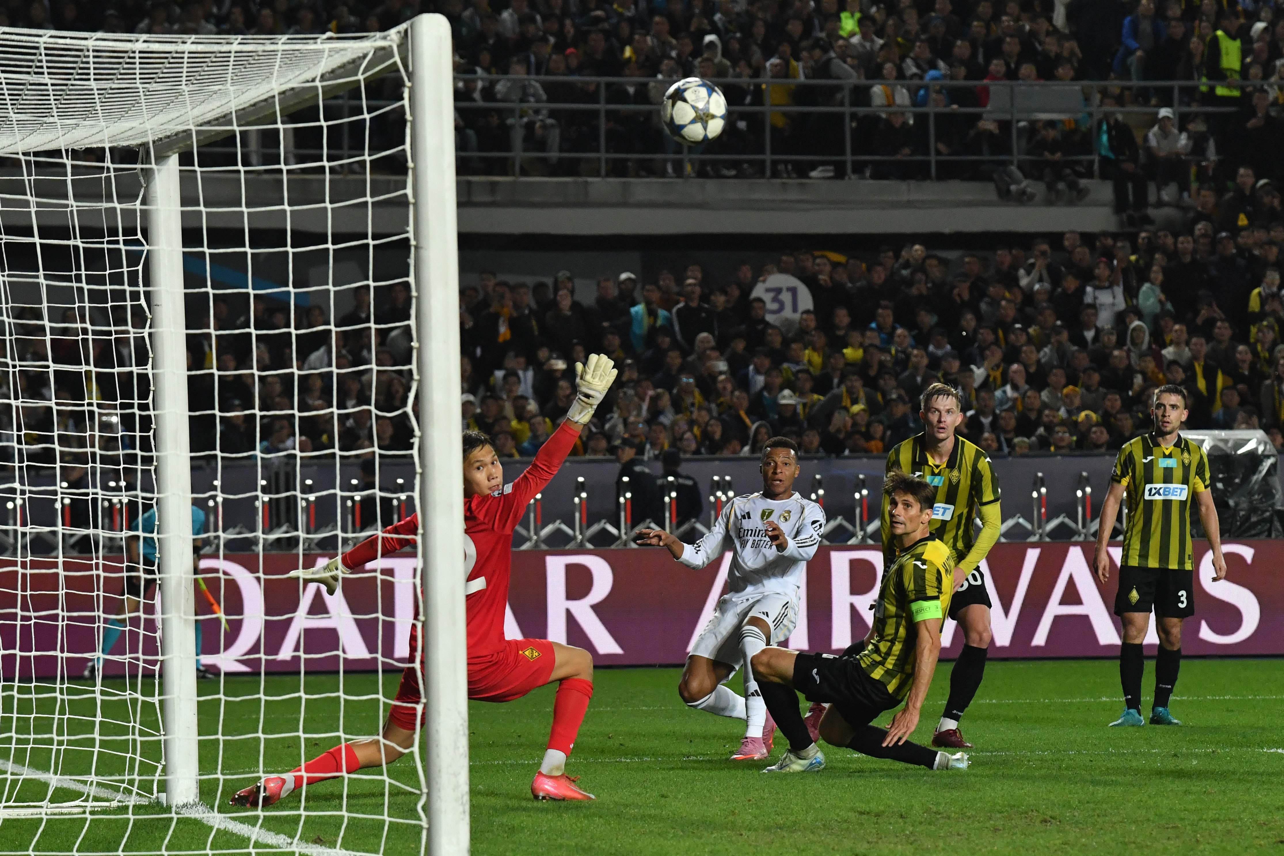 Real Madrid's French forward #10 Kylian Mbappe (2nd L) reacts in front of Kairat Almaty's Kazakh goalkeeper #82 Sherhan Kalmurza during the UEFA Champions League first round day 2 football match between Kairat Almaty and Real Madrid at the Almaty Ortalyk stadion in Almaty on September 30, 2025. (Photo by Vyacheslav OSELEDKO / AFP)