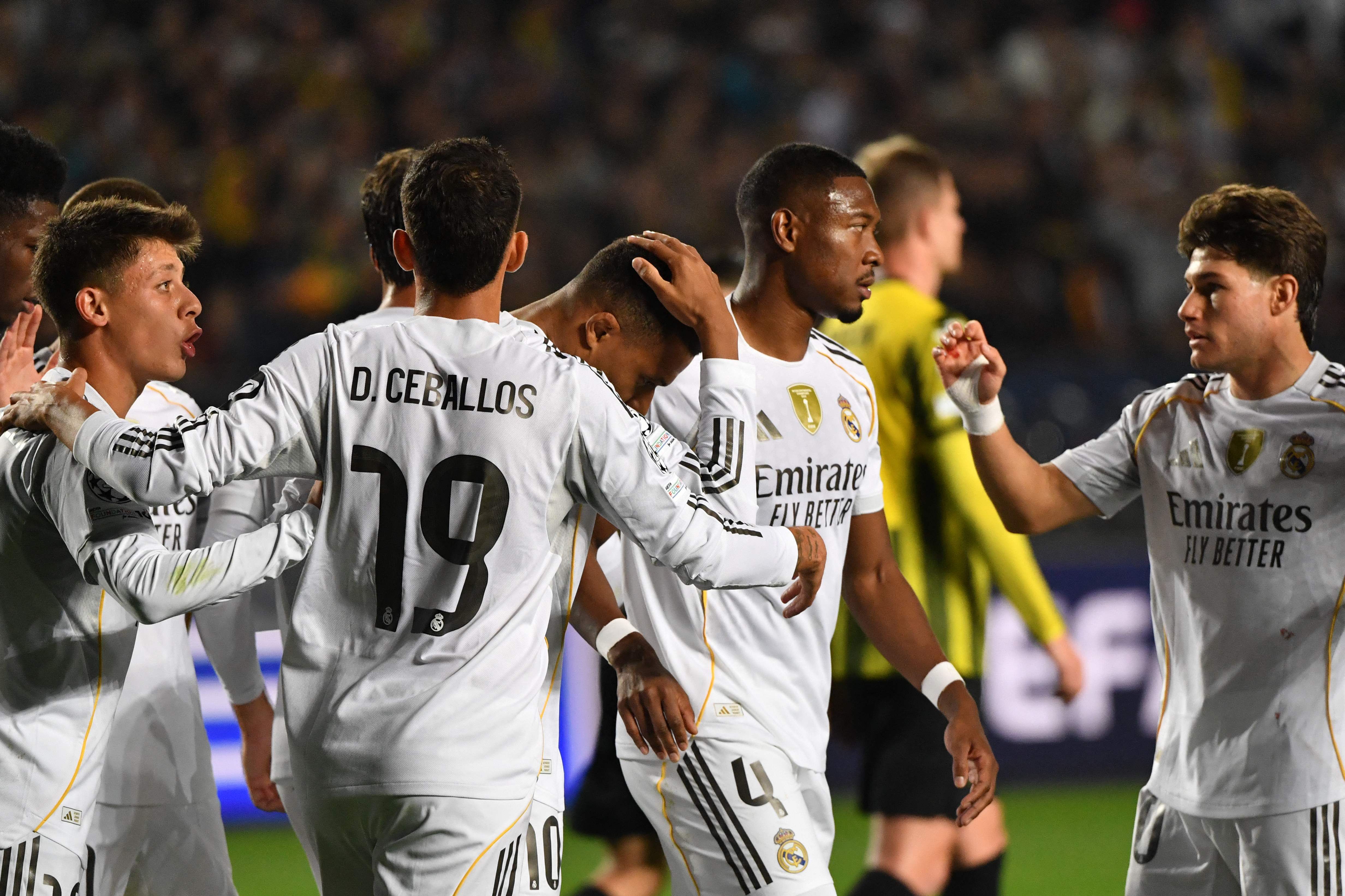 Real Madrid's French forward #10 Kylian Mbappe (C) celebrates with his teammates after scoring the 0-1 goal during the UEFA Champions League first round day 2 football match between Kairat Almaty and Real Madrid at the Almaty Ortalyk stadion in Almaty on September 30, 2025. (Photo by Vyacheslav OSELEDKO / AFP)