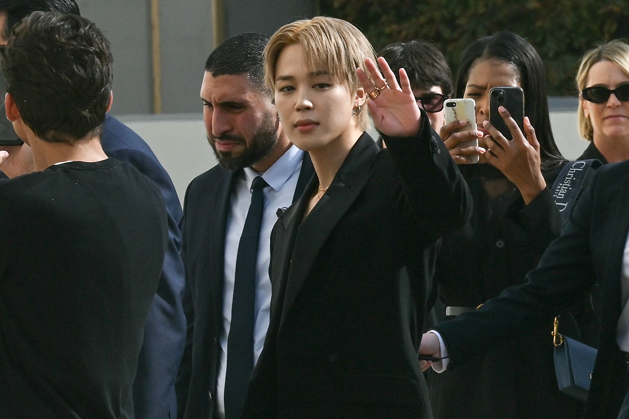 South Corean Jimin of the K-pop boy band BTS and Dior global ambassador arrives for the presentation of creations by Dior for the Women Ready-to-wear Spring-Summer 2026 collection as part of the Paris Fashion Week, in Paris on October 1, 2025. (Photo by Anna KURTH / AFP)